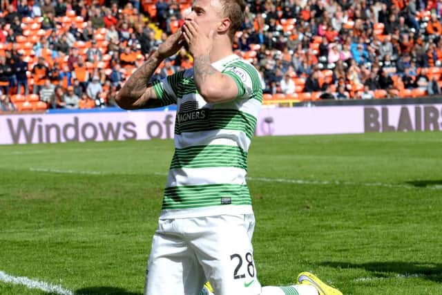 Celtic striker Leigh Griffiths celebrates completing his hat-trick with his penalty against Dundee United. Picture: SNS Group
