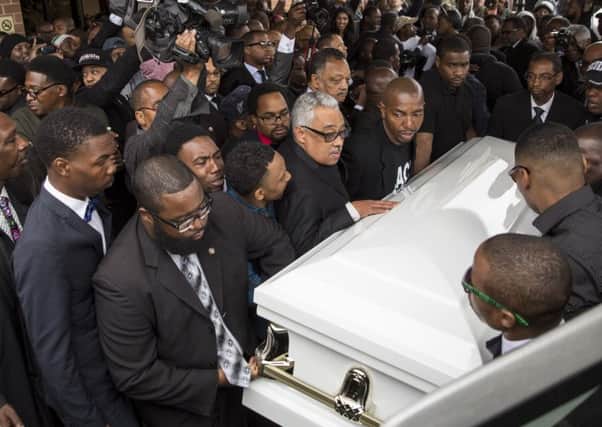 Pallbearers carry the casket of Freddie Gray to the hearse after his funeral service in Baltimore yesterday. Picture: Getty