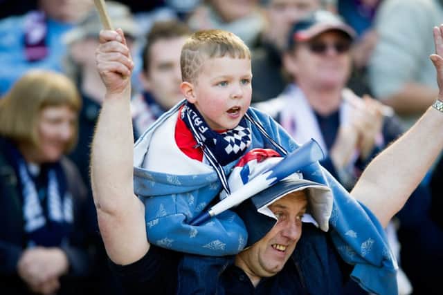 A young Falkirk fan celebrates after their semifinal win. Picture: John Devlin