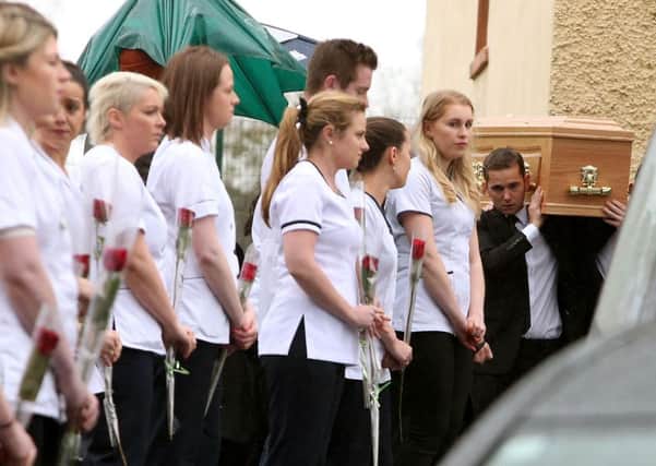 The coffin of student Karen Buckley is carried from the Church of St. Michael the Archangel, Analeentha, Co. Cork. Picture: PA