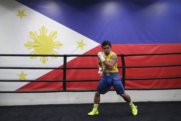 Manny Pacquiao works out near a Philippines flag at the Wild Card gym in Los Angeles. Picture: AP