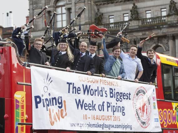 Pipers aboard a double decker bus at the launch in Glasgow of this year's Piping Live! Glasgow International Piping Festival and the World Pipe Band Championships. Picture: PA