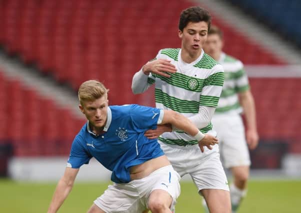 Rangers' Max Ashmore is challenged by Ciaran McKenna of Celtic at Hampden last night. Picture: SNS
