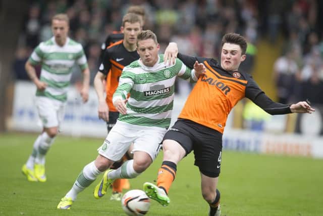 John Souttar battles with Kris Commons during Dundee United's match Celtic on April 26th 2015. Picture: PA