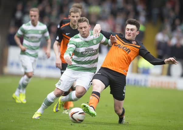 John Souttar battles with Kris Commons during Dundee United's match Celtic on April 26th 2015. Picture: PA