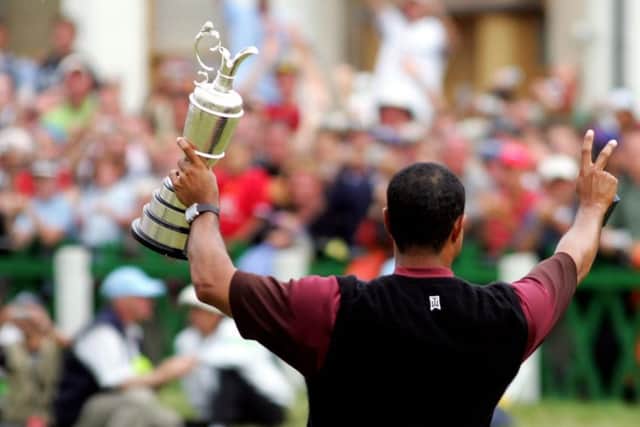 Tiger Woods holds aloft the Claret Jug at the Old Course in 2005. Picture: Getty