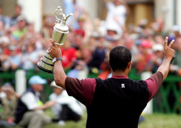 Tiger Woods holds aloft the Claret Jug at the Old Course in 2005. Picture: Getty