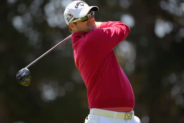 Marc Warren hits his tee shot on the fifth hole during round one of the World Golf Championship Cadillac Match Play. Picture: Getty