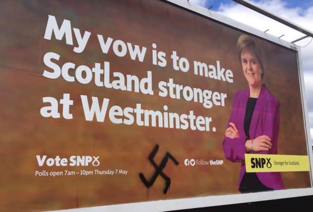 The defaced campaign poster in Govan. Picture: Twitter/@alextomo