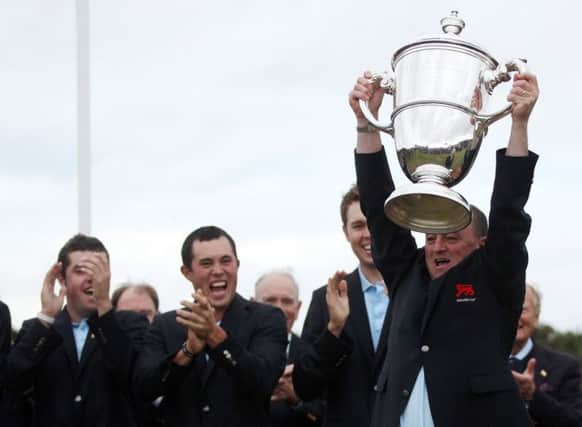 Victorious Great Britain & Ireland captain Nigel Edwards lifts the Walker Cup at Royal Aberdeen Golf Club in 2011. Picture: Getty