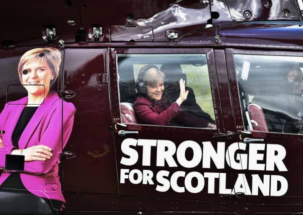 Nicola Sturgeon on board a helicopter yesterday. Picture: Getty