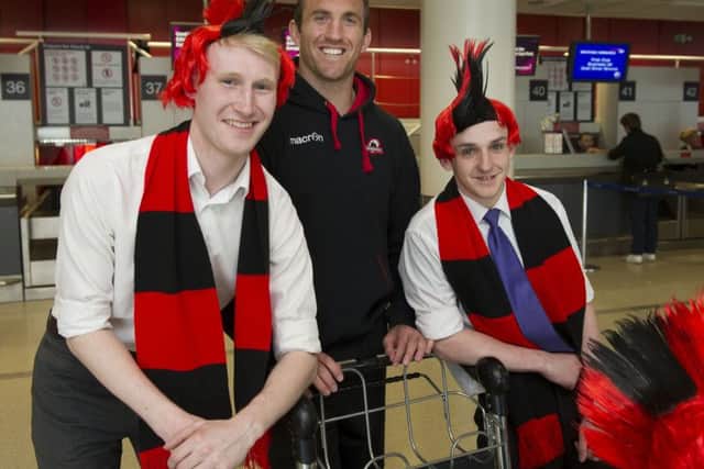 Edinburgh captain Mike Coman with Edinburgh Airport staff before flying to London for the European Challenge Cup final. Picture: Ian Rutherford