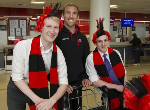 Edinburgh captain Mike Coman with Edinburgh Airport staff before flying to London for the European Challenge Cup final. Picture: Ian Rutherford