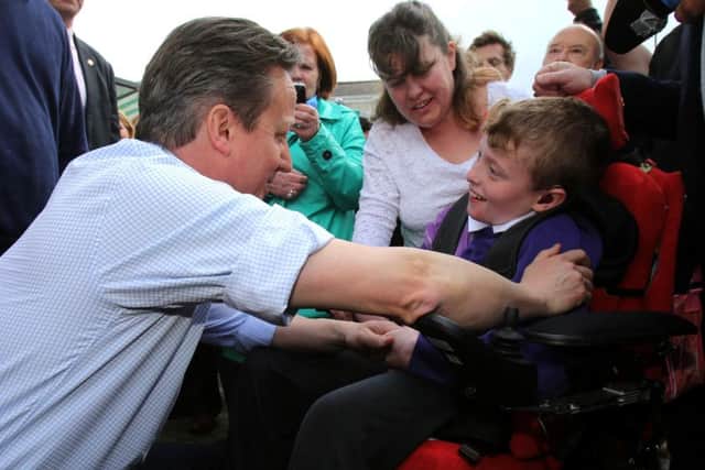 Prime Minister David Cameron meets Zak Raynor, 12. Picture: PA