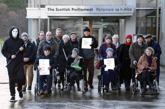 An anti-assisted dying protest greet MSPs at the Scottish Parliament back in January. Picture: Gordon Fraser