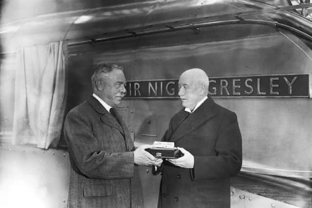 William Whitelaw presents railway engineer Sir Nigel Gresley with a silver model of the engine named after him in November 1937. Picture: Getty