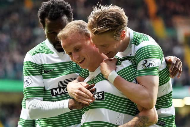 Celtic's Leigh Griffiths (centre) is mobbed by team-mates as they celebrate his opener. Picture: SNS
