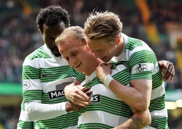 Celtic's Leigh Griffiths (centre) is mobbed by team-mates as they celebrate his opener. Picture: SNS