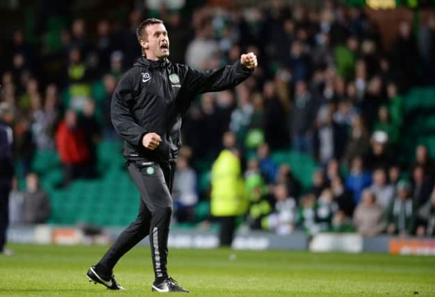 Manager Ronny Deila hails Celtic's win with a customary post-match fist pump. Picture: SNS