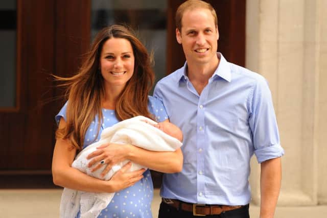 The Duke and Duchess of Cambridge their then-newborn son, Prince George of Cambridge, in 2013. Picture: PA