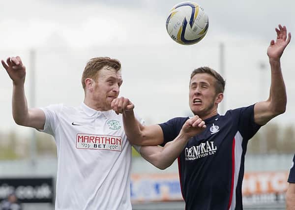 Liam Craig (left) competes in the air with Falkirk's Will Vaulks. Picture: SNS Group