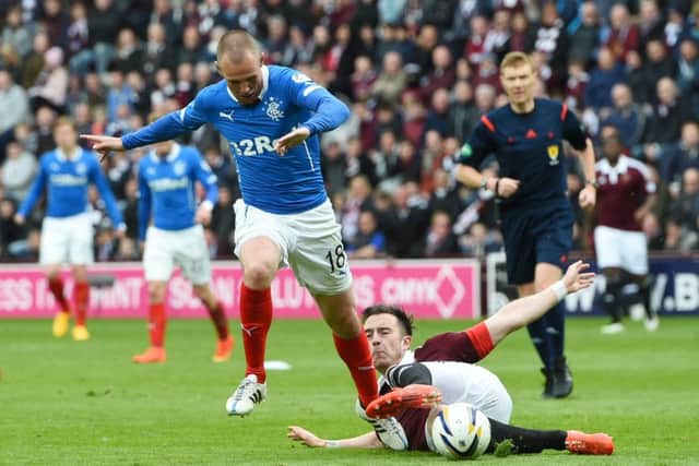 Rangers' Kenny Miller (left) is tackled by Danny Wilson. Picture: SNS Group