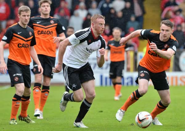 Aberdeen's Adam Rooney (left) runs from Dundee United's Callum Morris. Picture: SNS Group