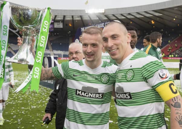 Leigh Griffiths (left) and Scott Brown celebrate winning the Scottish League Cup in March. Picture: PA