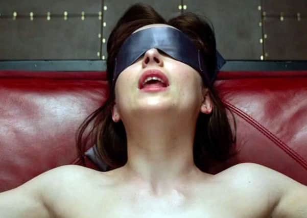 Dakota Johnson stars as Anastasia Steele in the film adaptation of Fifty Shades Of Grey. Picture: PA