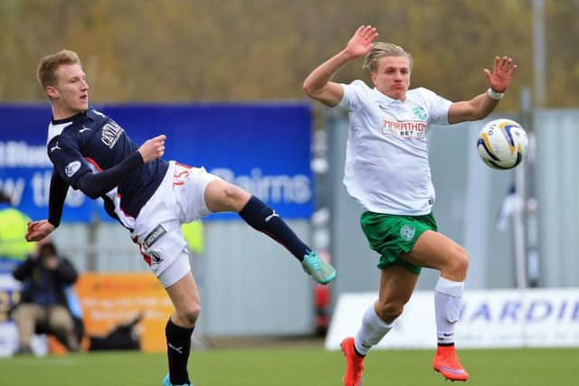 Jason Cummings, left, breaks away. Picture: Gordon Fraser