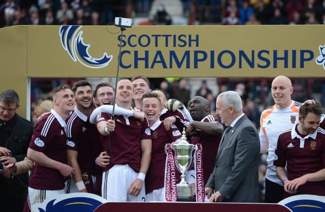 Brad McKay holds the selfie stick as the Hearts players get into party mood. Picture: Neil Hanna