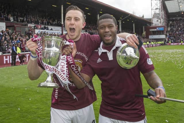 Hearts lifted the Scottish Championship trophy on the same day Celtic secured the Scottish Premiership title. Picture: PA