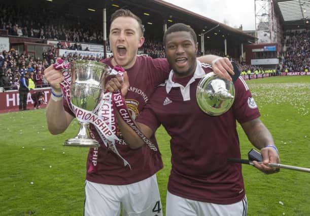 Hearts lifted the Scottish Championship trophy on the same day Celtic secured the Scottish Premiership title. Picture: PA