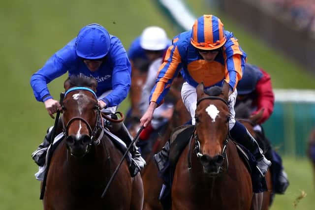 Ryan Moore, orange and blue cap, rides Legatissimo to victory in the Qipco 1,000 Guineas. Picture: Getty