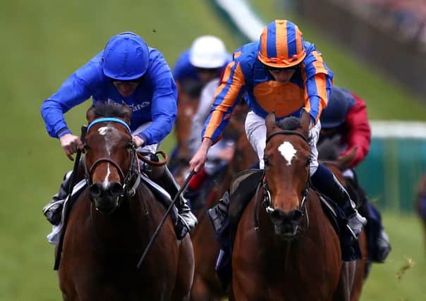 Ryan Moore, orange and blue cap, rides Legatissimo to victory in the Qipco 1,000 Guineas. Picture: Getty