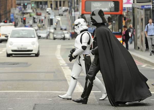 Darth Vader goes for a walk in Edinburgh with a Stormtrooper pal. Picture: Phil Wilkinson