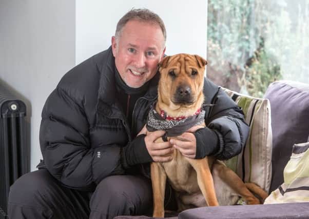 Ian Russell with Kai, who made headlines after being abandoned at Ayr railway station. Picture: PA