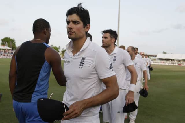 England's captain Alastair Cook leads his team off the field after losing the third Test to the West Indies in Bridgetow. Picture: AP