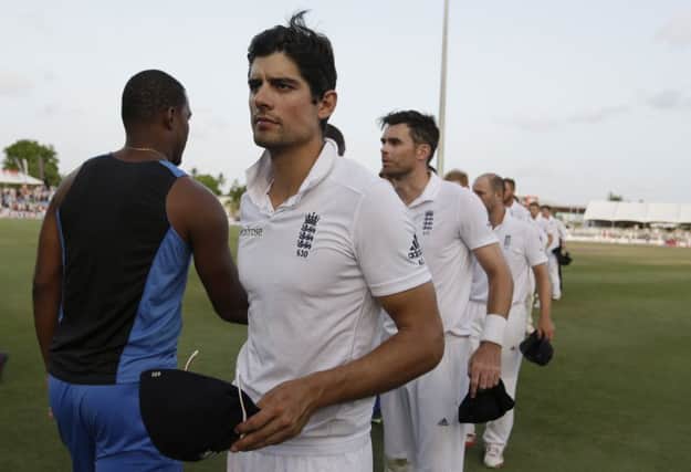 England's captain Alastair Cook leads his team off the field after losing the third Test to the West Indies in Bridgetow. Picture: AP