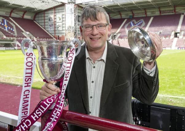 Hearts director of football Craig Levein with the Scottish Championship trophy. Picture: Ian Rutherford