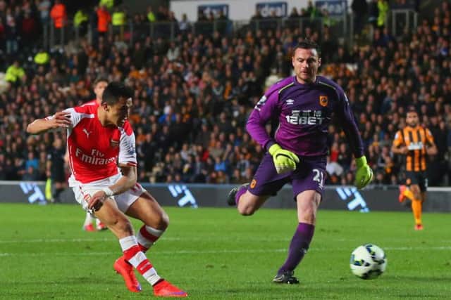 Arsenal's Chilean striker Alexis Sanchez rounds Steve Harper to score his second goal. Picture: Getty