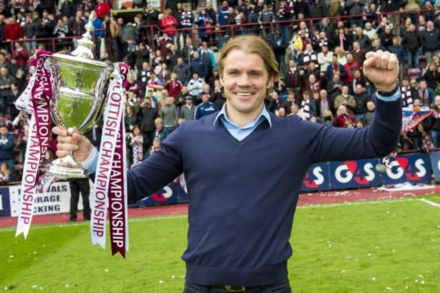 Robbie Neilson celebrates with the Scottish Championship trophy. Picture: SNS