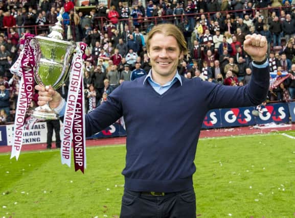 Robbie Neilson celebrates with the Scottish Championship trophy. Picture: SNS