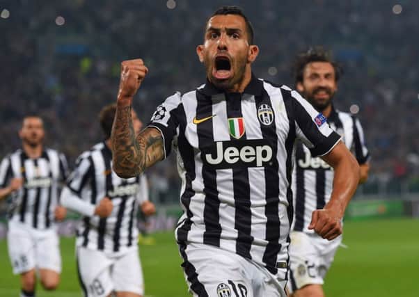 Juventus forward Carlos Tevez celebrates after scoring their second goal. Picture: Getty