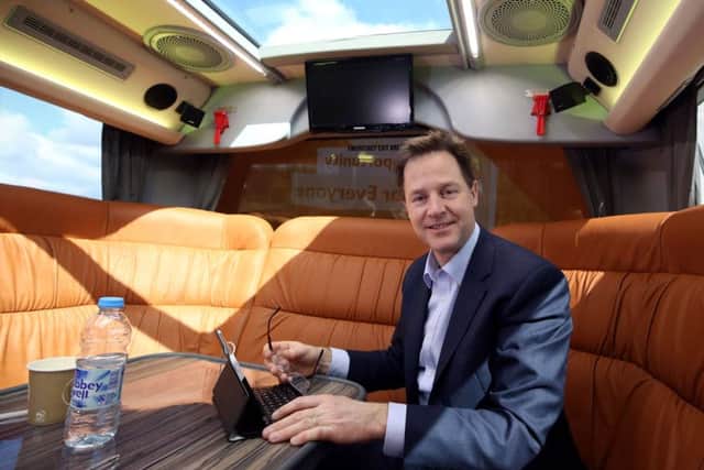 Liberal Democrat party leader Nick Clegg working on the party's battle bus. Picture: PA
