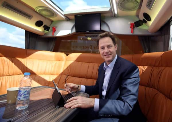 Liberal Democrat party leader Nick Clegg working on the party's battle bus. Picture: PA