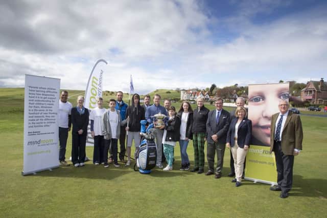 Marc Warren, centre, yesterday helped launch the official charity of the Aberdeen Asset Management Scottish Open. Picture: Kenny Smith