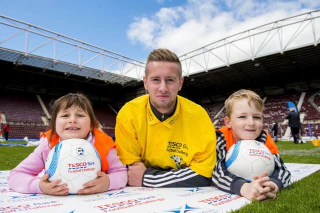 Billy King promotes the Tesco Bank Football Festival with Abbey Cottle and Milo Webster. Picture: SNS