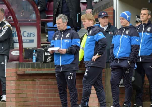 Rangers manager Stuart McCall consults with Kenny Black as Hearts manager Robbie Neilson watches on from the stand. Picture: SNS
