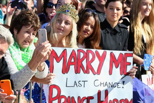 Members of the public wait to meet Prince Harry during a walkabout outside the Sydney Opera House. Picture: Getty